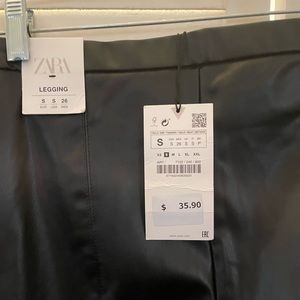 Black faux leather leggings.  Side zipper. BNWT size small.